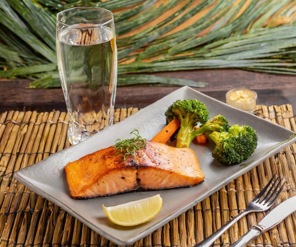 Firefly Grilled Salmon, Sweet Potato, Steamed Broccoli_ in a restaurant bar on a rectangular plate w